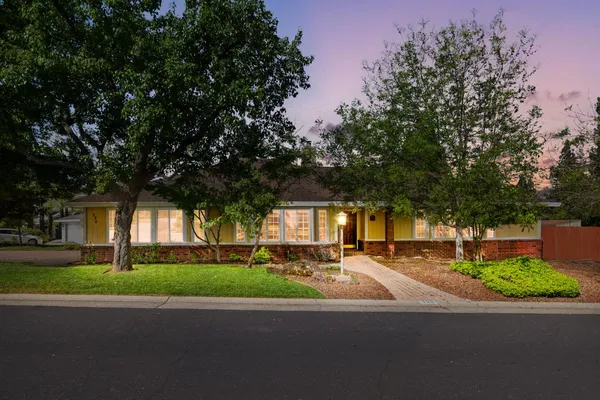 a kitchen with stainless steel appliances a refrigerator sink and cabinets