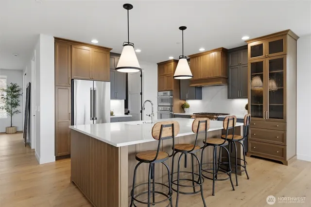 a dinning room with chairs and chandelier