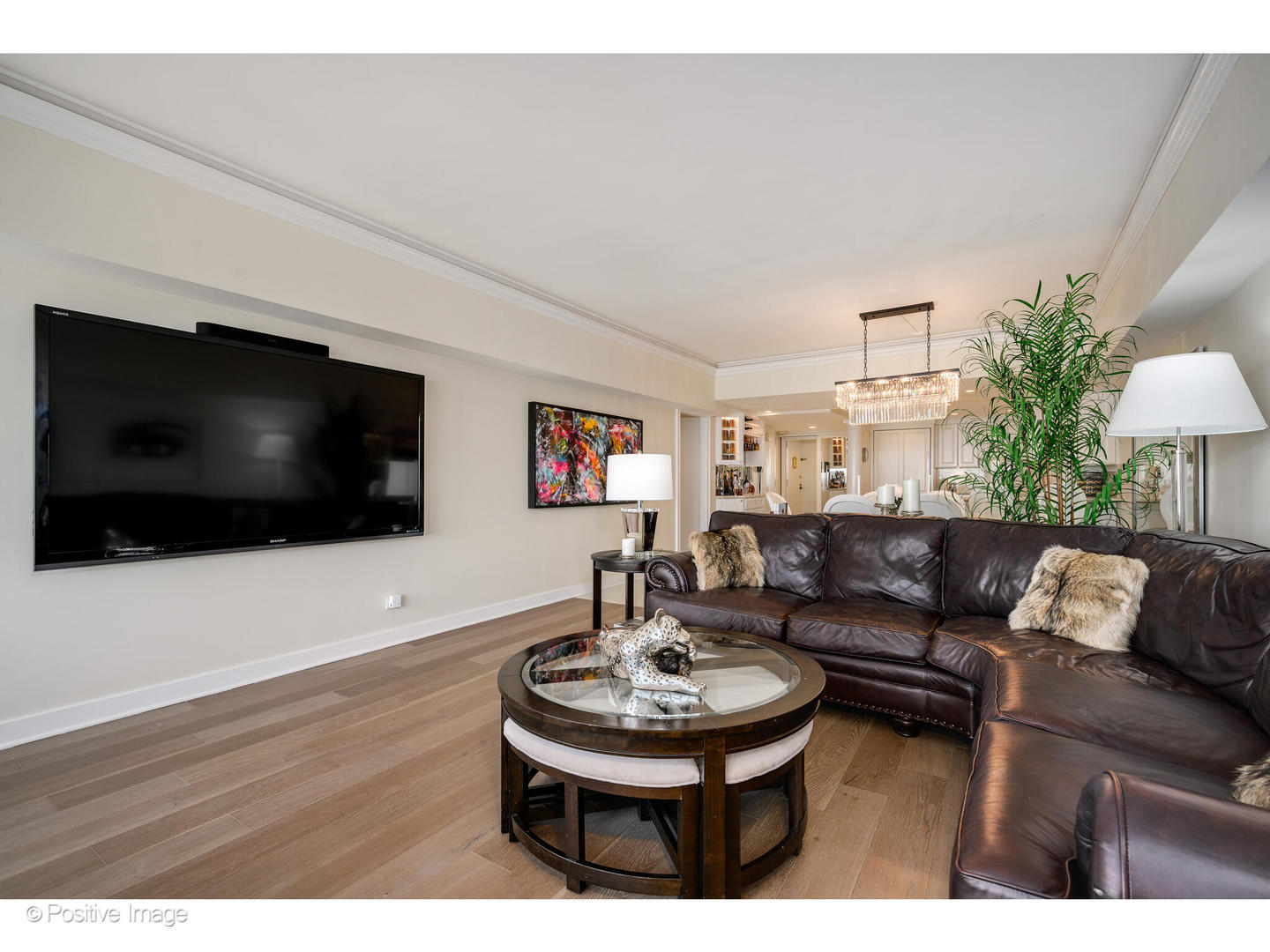 175 East Delaware Place, Unit 7107 Chicago, IL 60611 - Photo 6 of 24 a living room with furniture and a flat screen tv