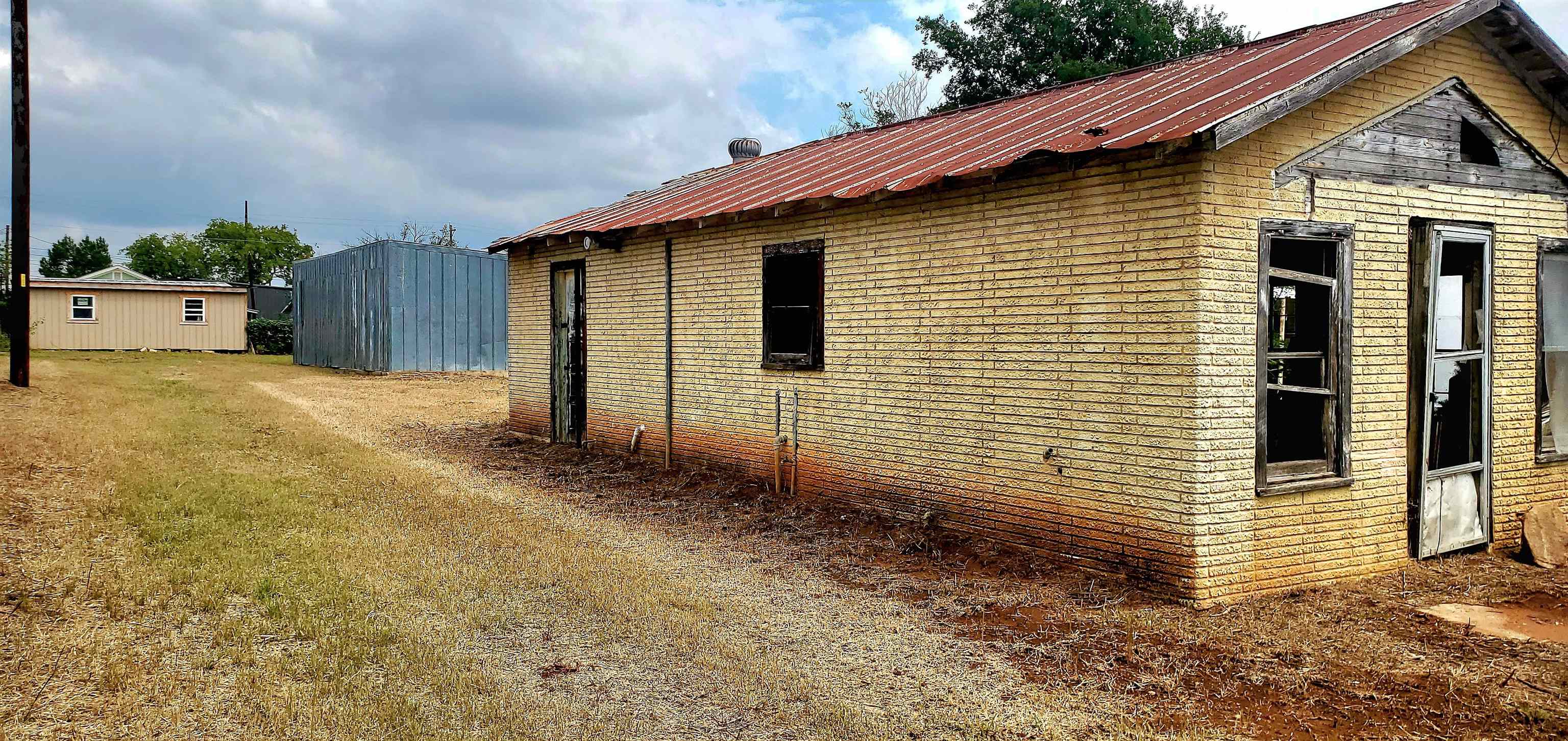 103 East Houston Street Llano, TX 78643 - Photo 6 of 7 a view of a house with backyard
