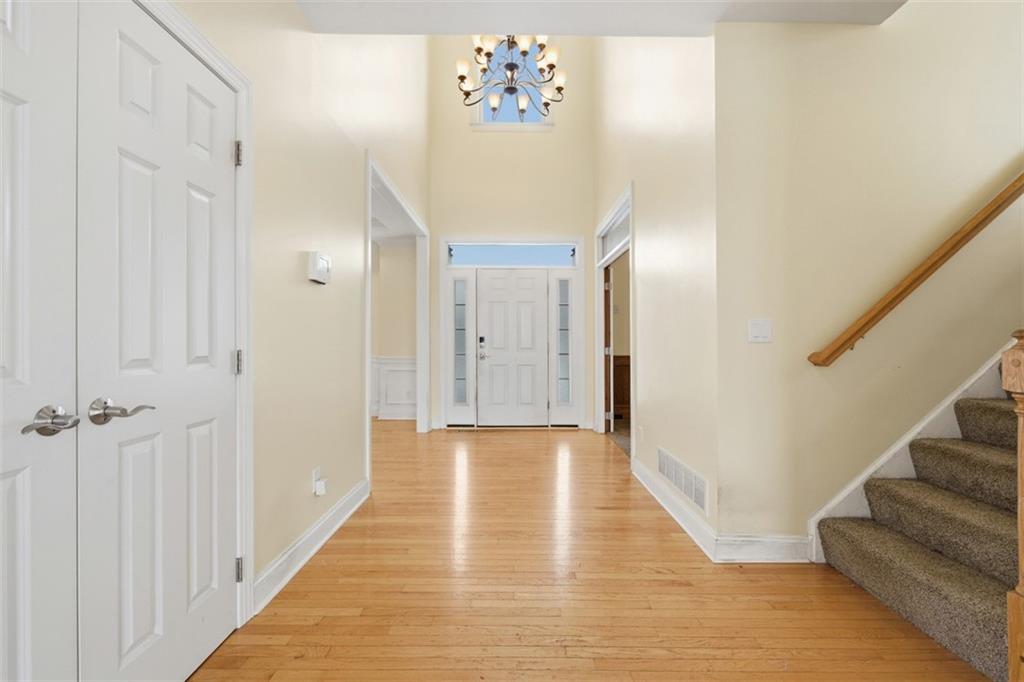 110 Timber Ridge Drive Harmony, PA 16037 - Photo 2 of 50 a view of a hallway with wooden floor and staircase