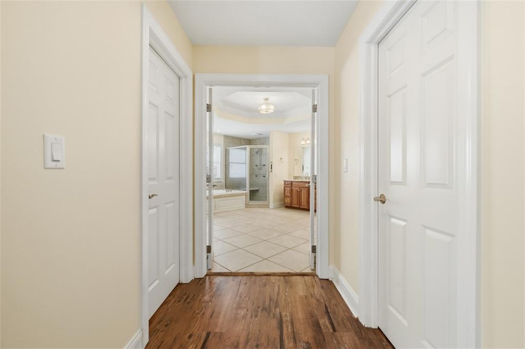 110 Timber Ridge Drive Harmony, PA 16037 - Photo 21 of 50 a view of a hallway with wooden floor and a bathroom