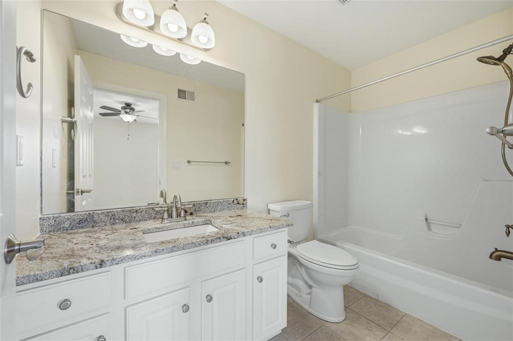 110 Timber Ridge Drive Harmony, PA 16037 - Photo 28 of 50 a bathroom with a granite countertop sink a toilet and shower
