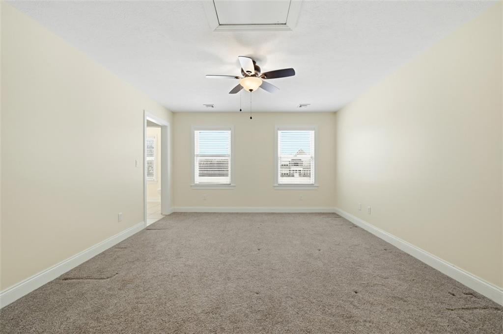 110 Timber Ridge Drive Harmony, PA 16037 - Photo 29 of 50 an empty room with windows and fan