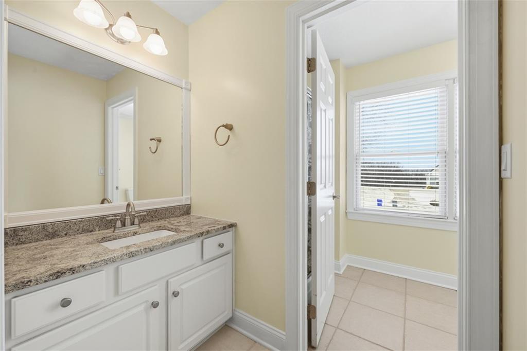 110 Timber Ridge Drive Harmony, PA 16037 - Photo 33 of 50 a bathroom with a granite countertop sink and a mirror