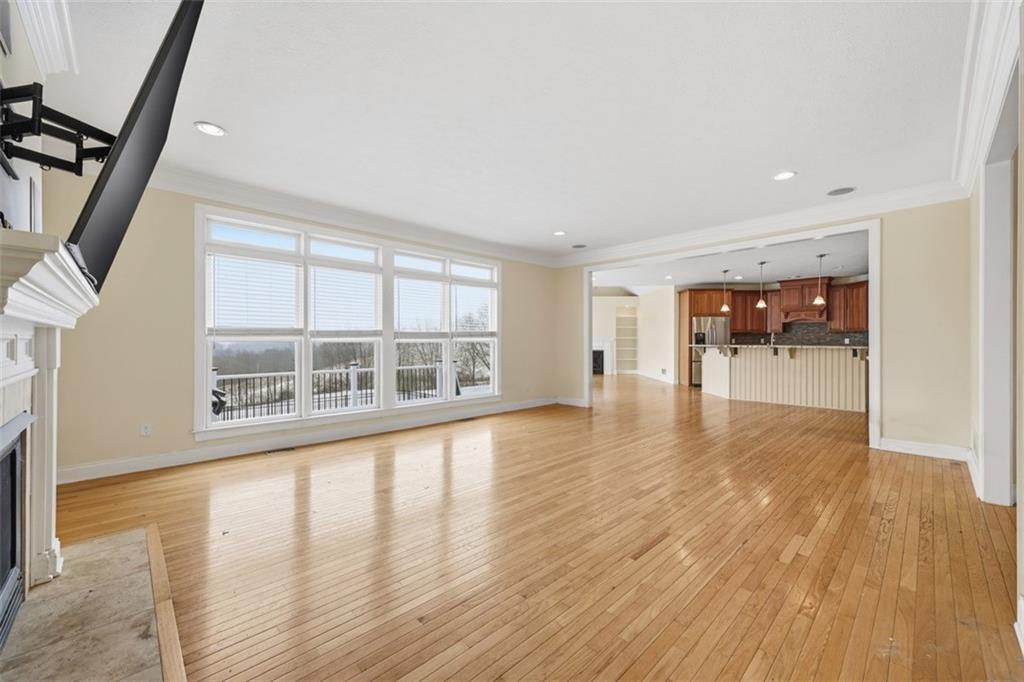 110 Timber Ridge Drive Harmony, PA 16037 - Photo 4 of 50 a view of an empty room with wooden floor and a window