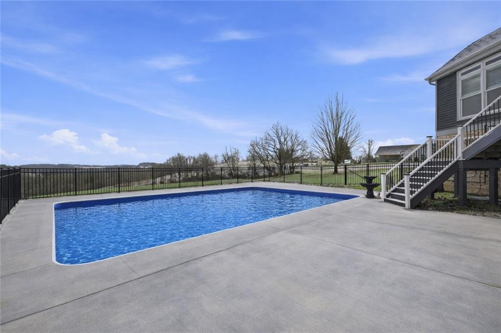 110 Timber Ridge Drive Harmony, PA 16037 - Photo 43 of 50 a view of outdoor space with swimming pool and trees