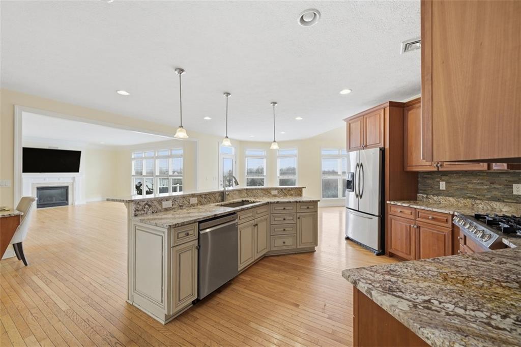 110 Timber Ridge Drive Harmony, PA 16037 - Photo 7 of 50 a large kitchen with stainless steel appliances granite countertop a stove and a refrigerator