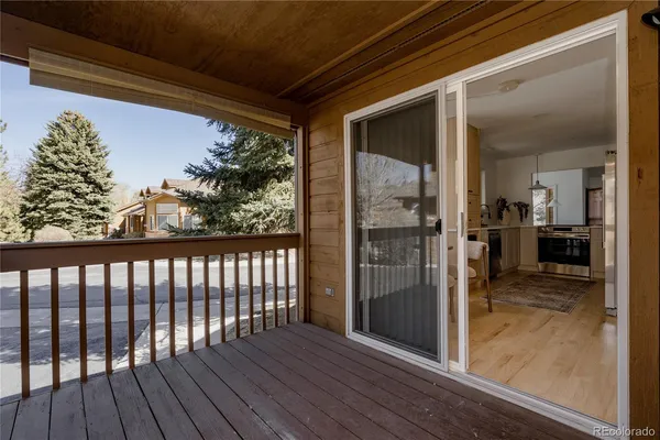 a view of balcony with wooden floor