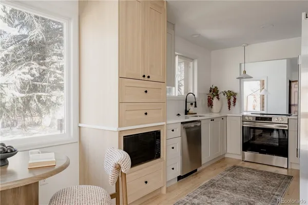 a kitchen with a sink and a window