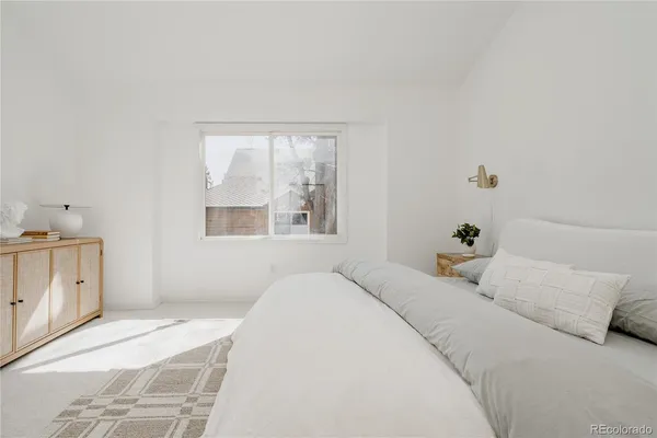 a bedroom with a bed and a cabinets