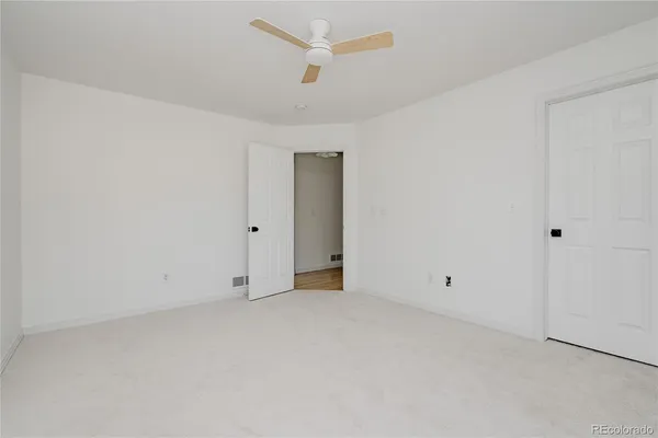 a bathroom with a toilet sink and shower