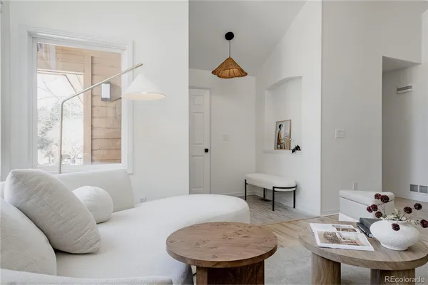 a living room with furniture and a table