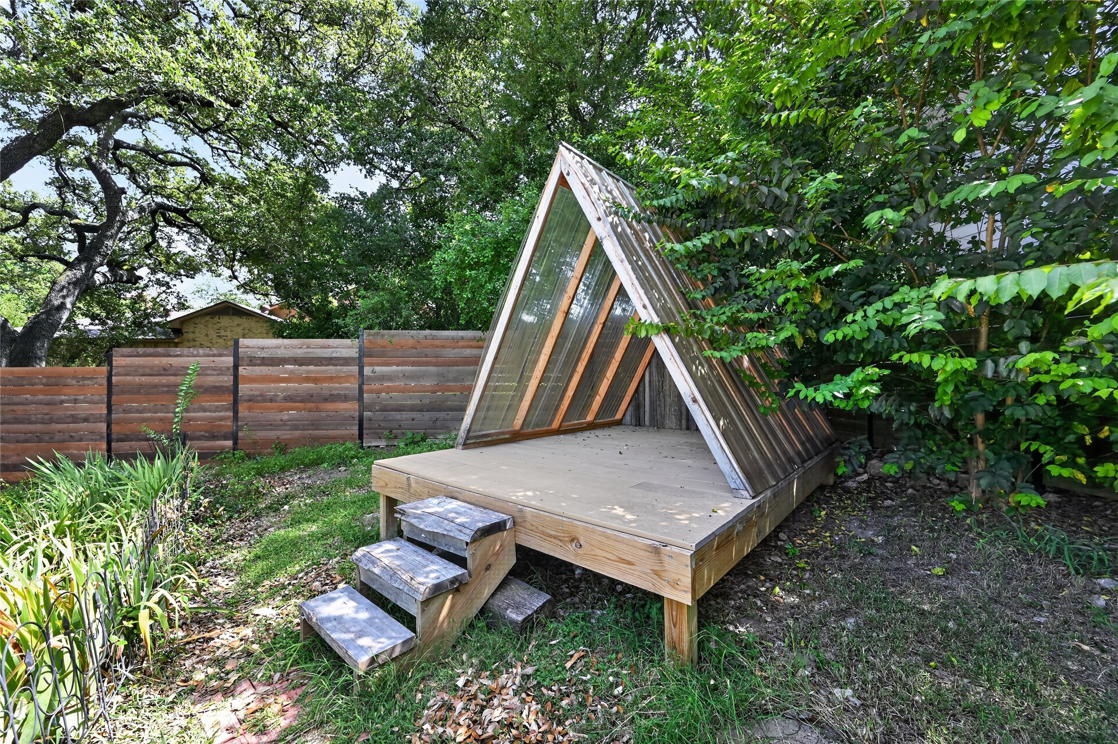 700 Willow Creek Road Salado, TX 76571 - Photo 33 of 39 Perched at the top of the backyard lot is a fun playhouse.