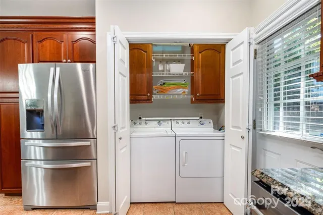 a utility room with closet dryer and washer