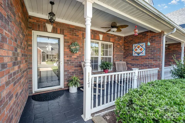 a view of a brick house with a large windows
