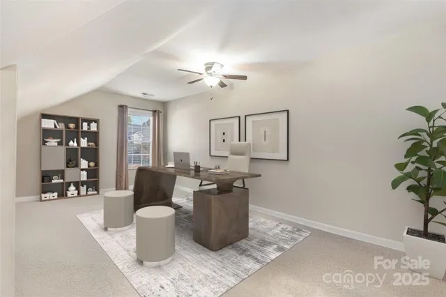 a living room with furniture a chandelier and a potted plant