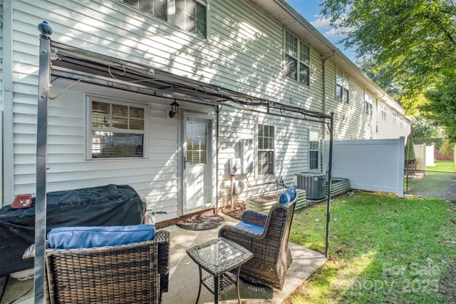 a view of backyard with patio