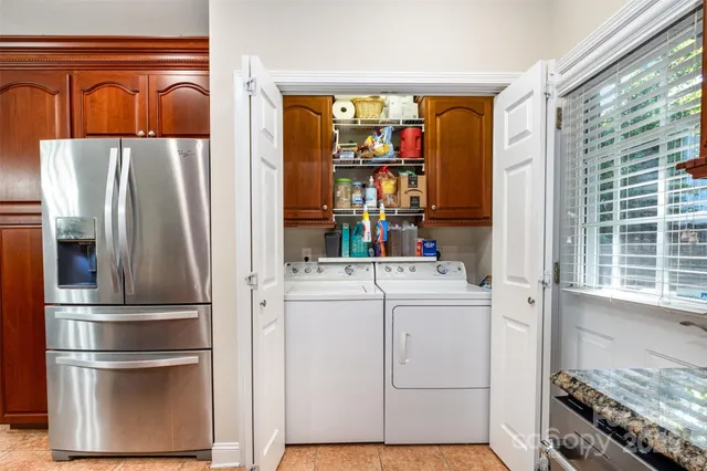 a bedroom with a bed couch and window