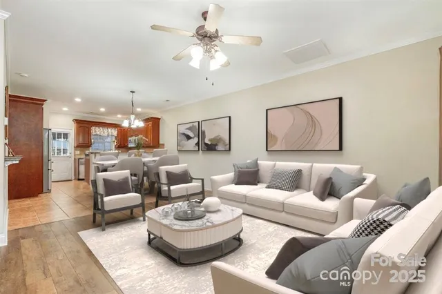a living room with furniture and a large mirror