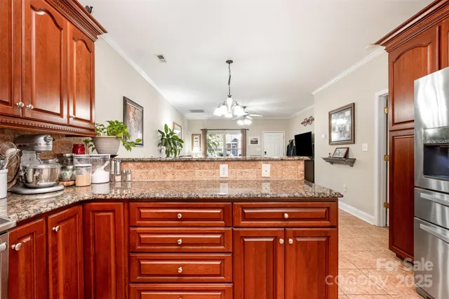 a kitchen with granite countertop stainless steel appliances and a sink