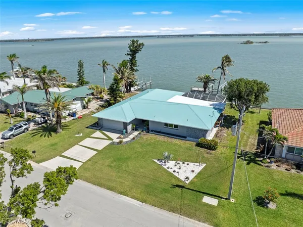 a aerial view of a house with swimming pool