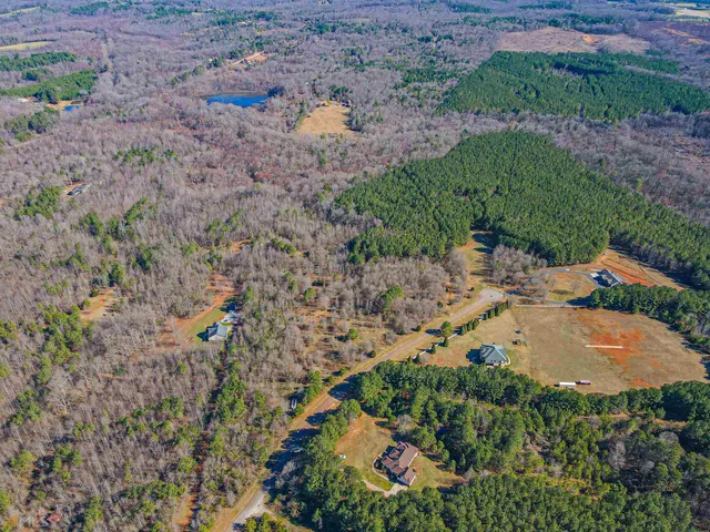 an aerial view of residential house with outdoor space