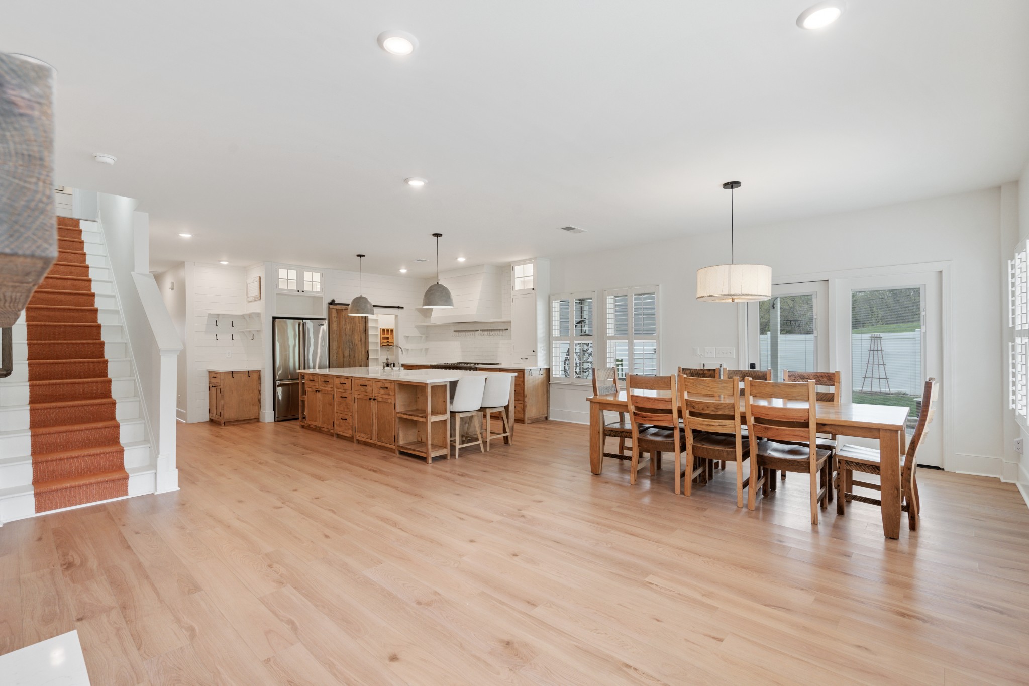 2056 Notchleaf Road Antioch, TN 37013 - Photo 12 of 42 a view of a dining area with furniture wooden floor and chandelier