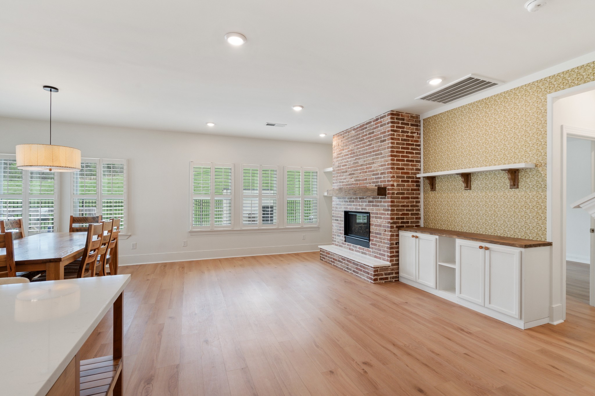 2056 Notchleaf Road Antioch, TN 37013 - Photo 13 of 42 a view of a kitchen with furniture a fireplace and wooden floor