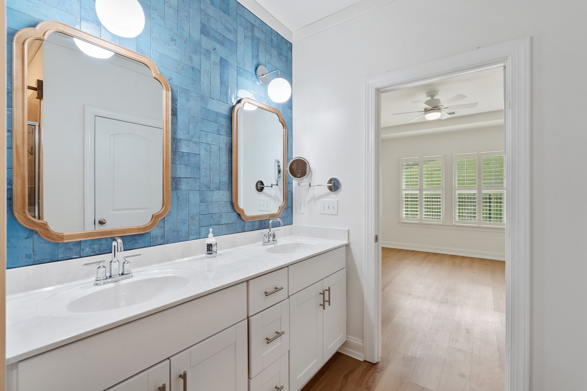 2056 Notchleaf Road Antioch, TN 37013 - Photo 19 of 42 a en suite bathroom with 2 sink flowerpot and a mirror