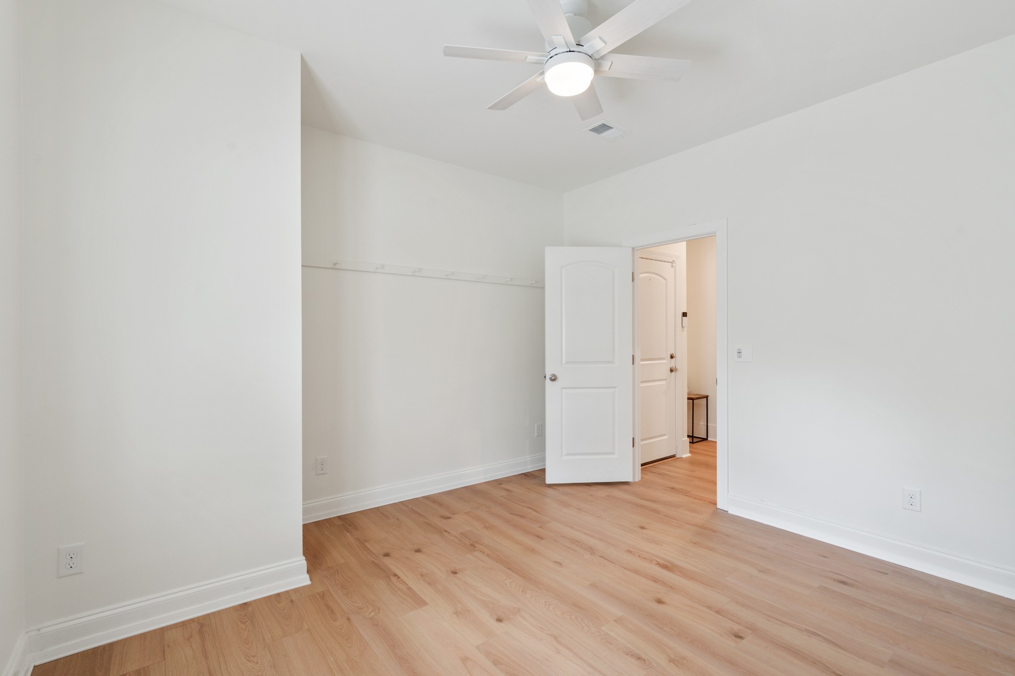 2056 Notchleaf Road Antioch, TN 37013 - Photo 27 of 42 a view of an empty room with wooden floor