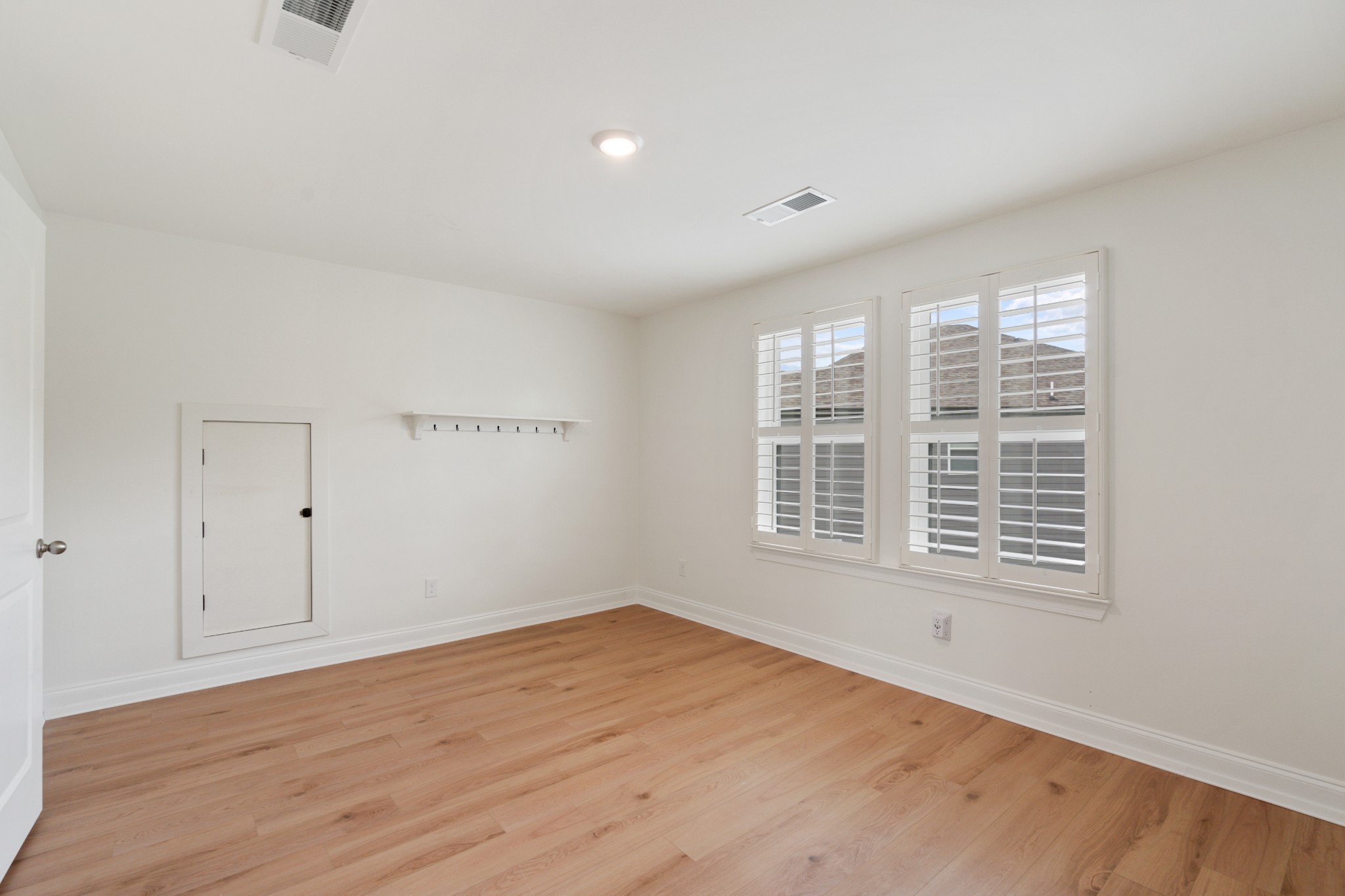 2056 Notchleaf Road Antioch, TN 37013 - Photo 31 of 42 a view of an empty room with wooden floor and a window