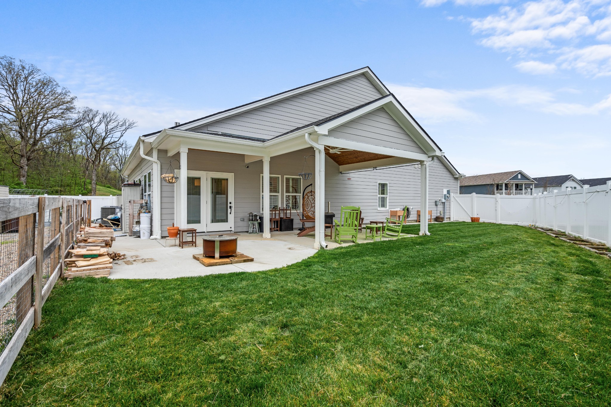 2056 Notchleaf Road Antioch, TN 37013 - Photo 33 of 42 a backyard of a house with table and chairs with plants and wooden fence