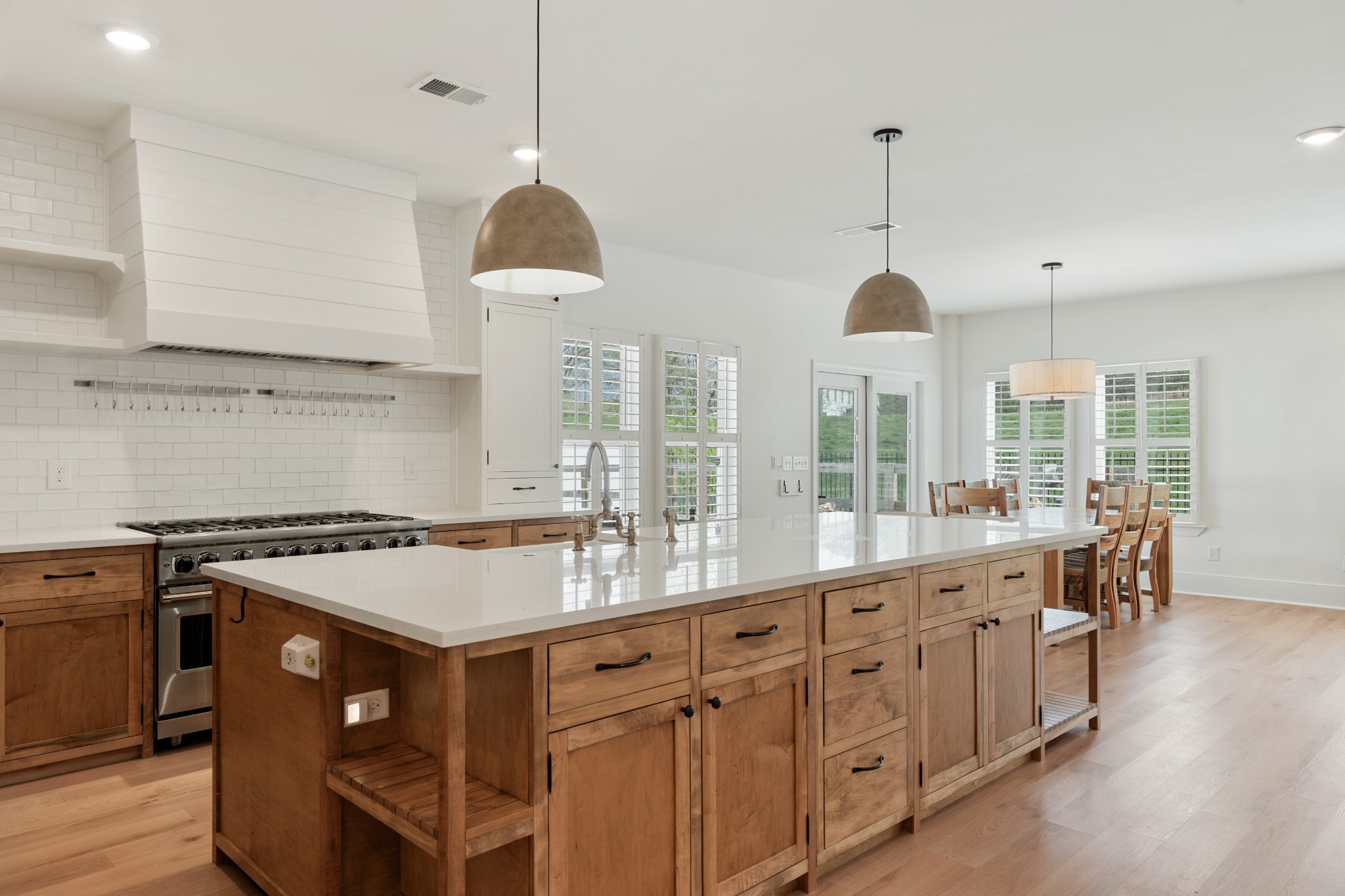 2056 Notchleaf Road Antioch, TN 37013 - Photo 5 of 42 a kitchen with kitchen island granite countertop a stove a sink a center island and windows