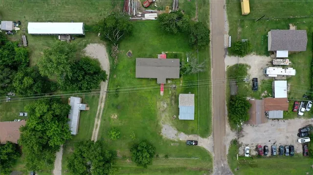 an aerial view of house with yard swimming pool and outdoor seating