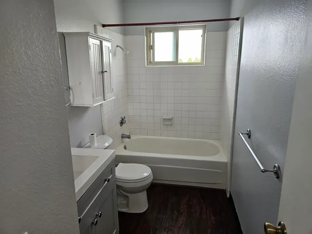 a bathroom with a bathtub toilet and sink