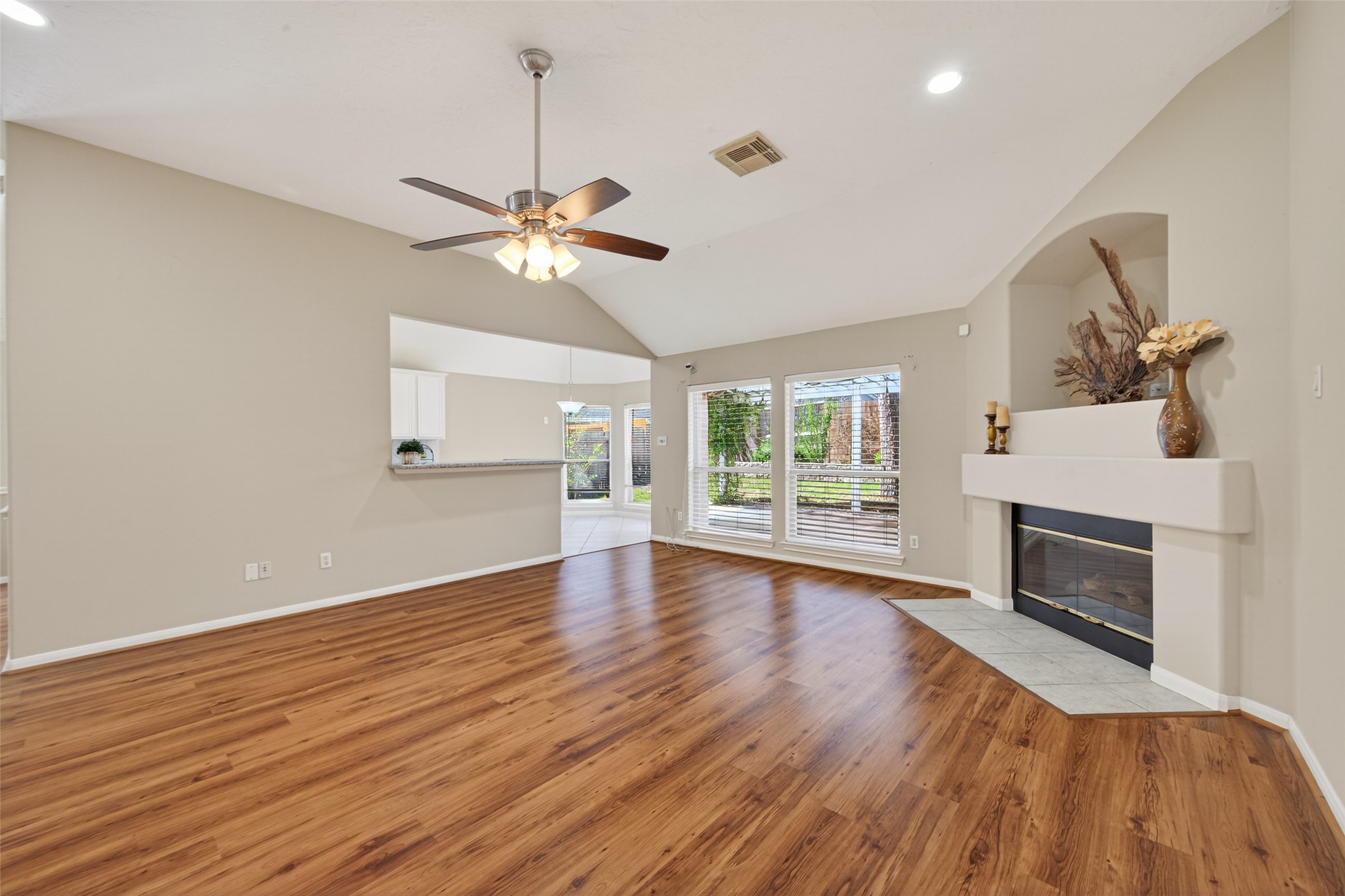 23211 Goldensong Court Spring, TX 77373 - Photo 9 of 50 Modern flooring and the Fireplace is the center piece of this room.