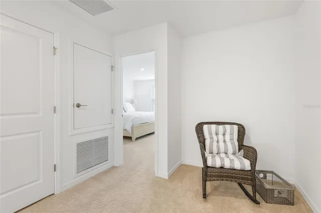 a view of a livingroom with furniture and a bathroom