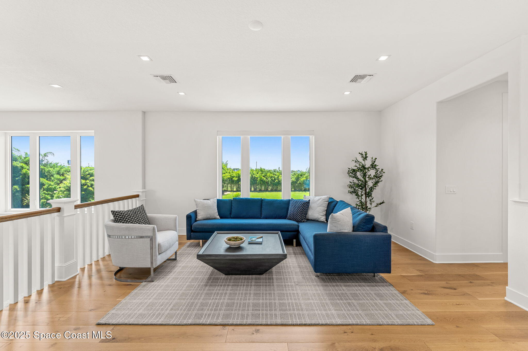1949 Rockledge Drive Rockledge, FL 32955 - Photo 16 of 48 a living room with furniture potted plant and a window