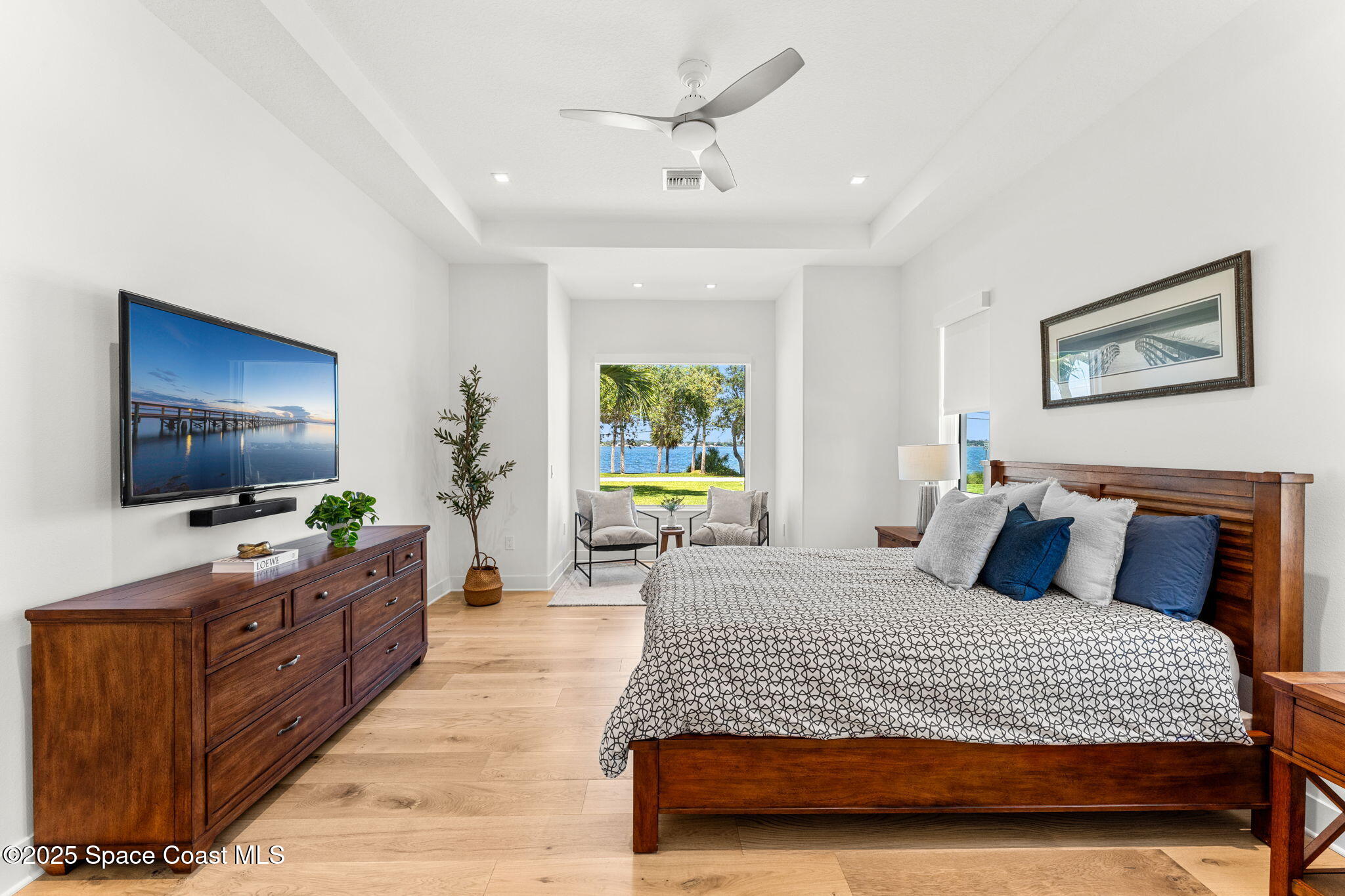 1949 Rockledge Drive Rockledge, FL 32955 - Photo 18 of 48 a bedroom with a large bed and a flat screen tv