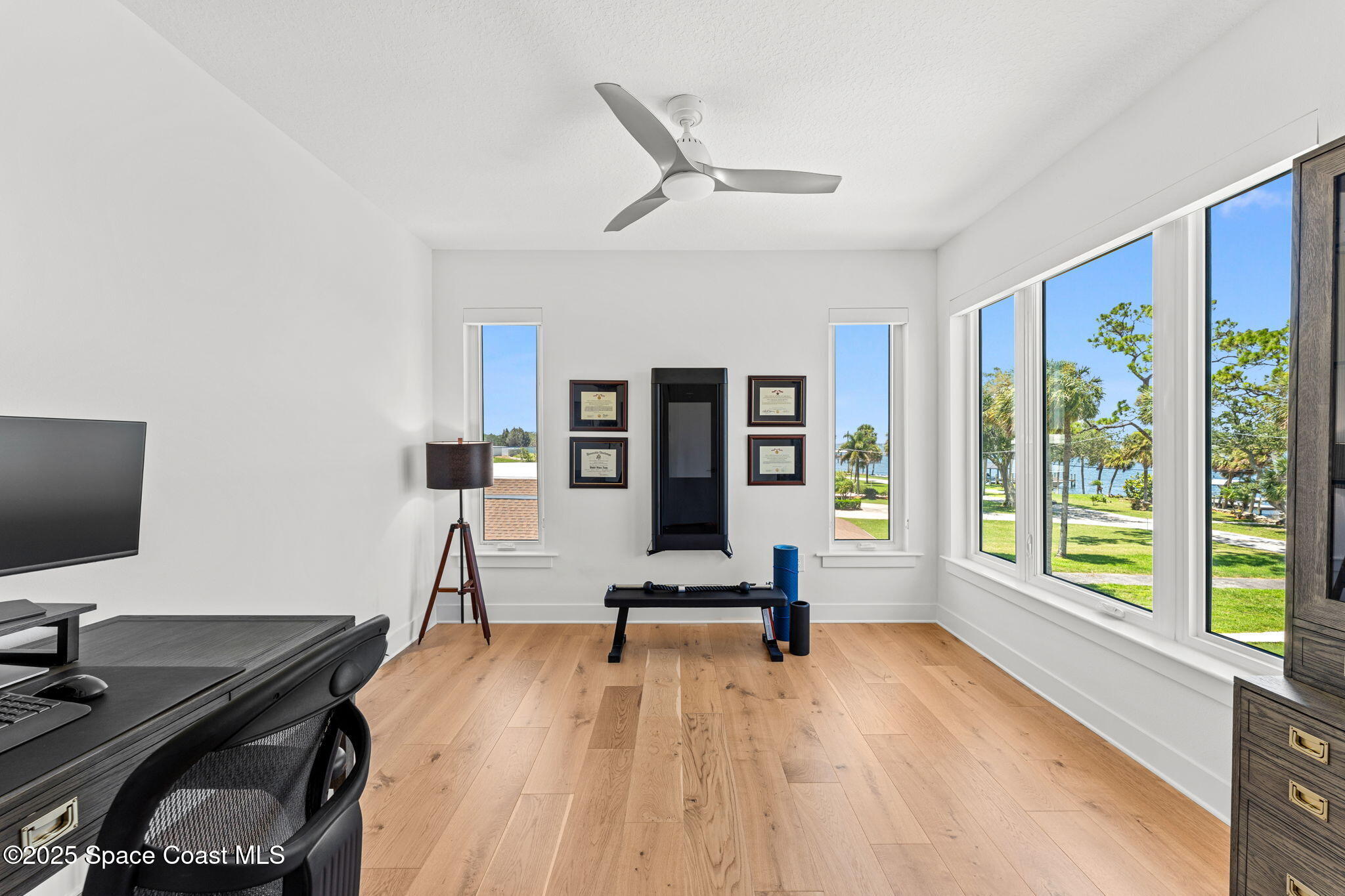 1949 Rockledge Drive Rockledge, FL 32955 - Photo 26 of 48 a view of a workspace with furniture and a large window