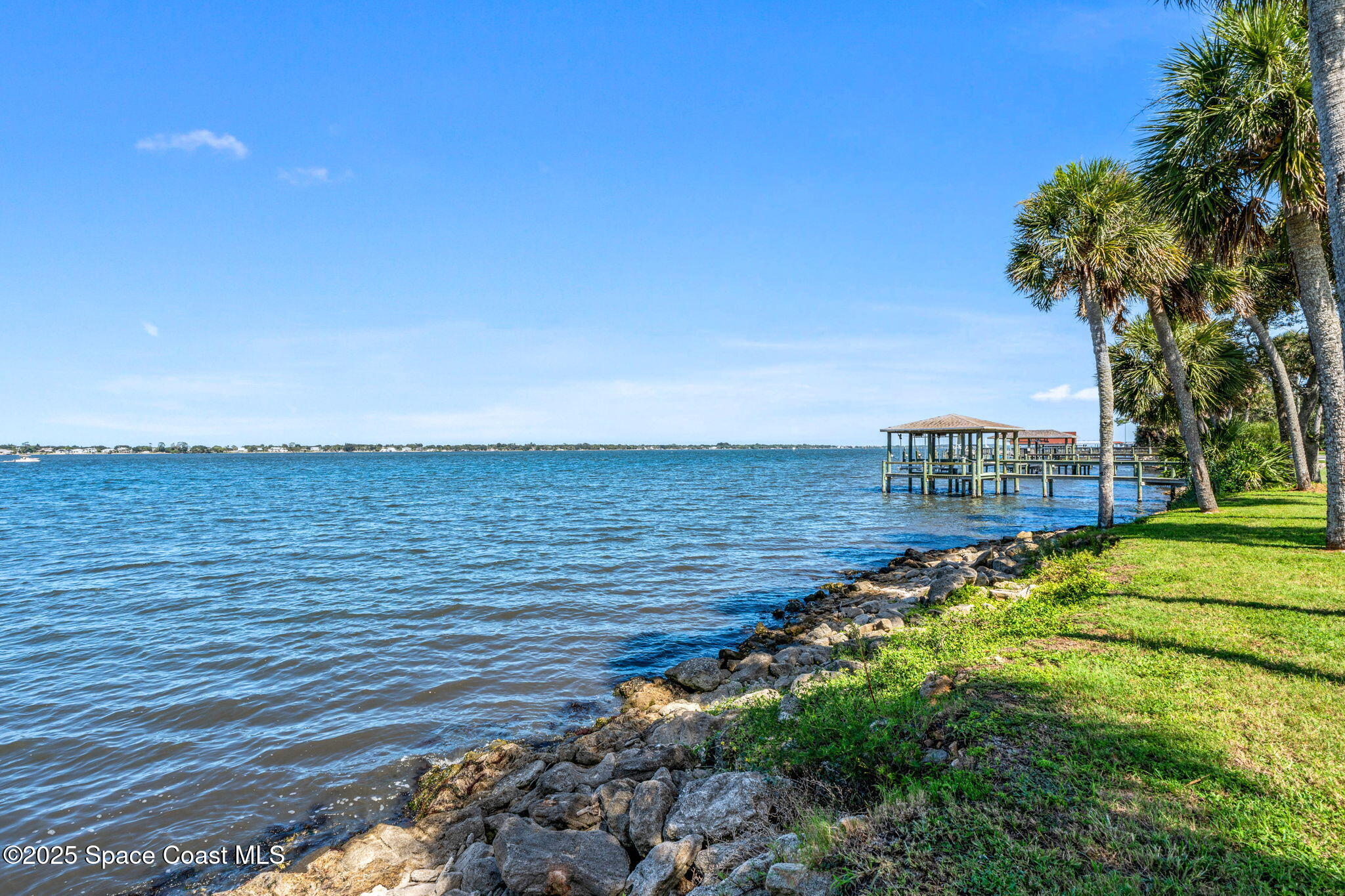1949 Rockledge Drive Rockledge, FL 32955 - Photo 36 of 48 a view of a lake with a yard