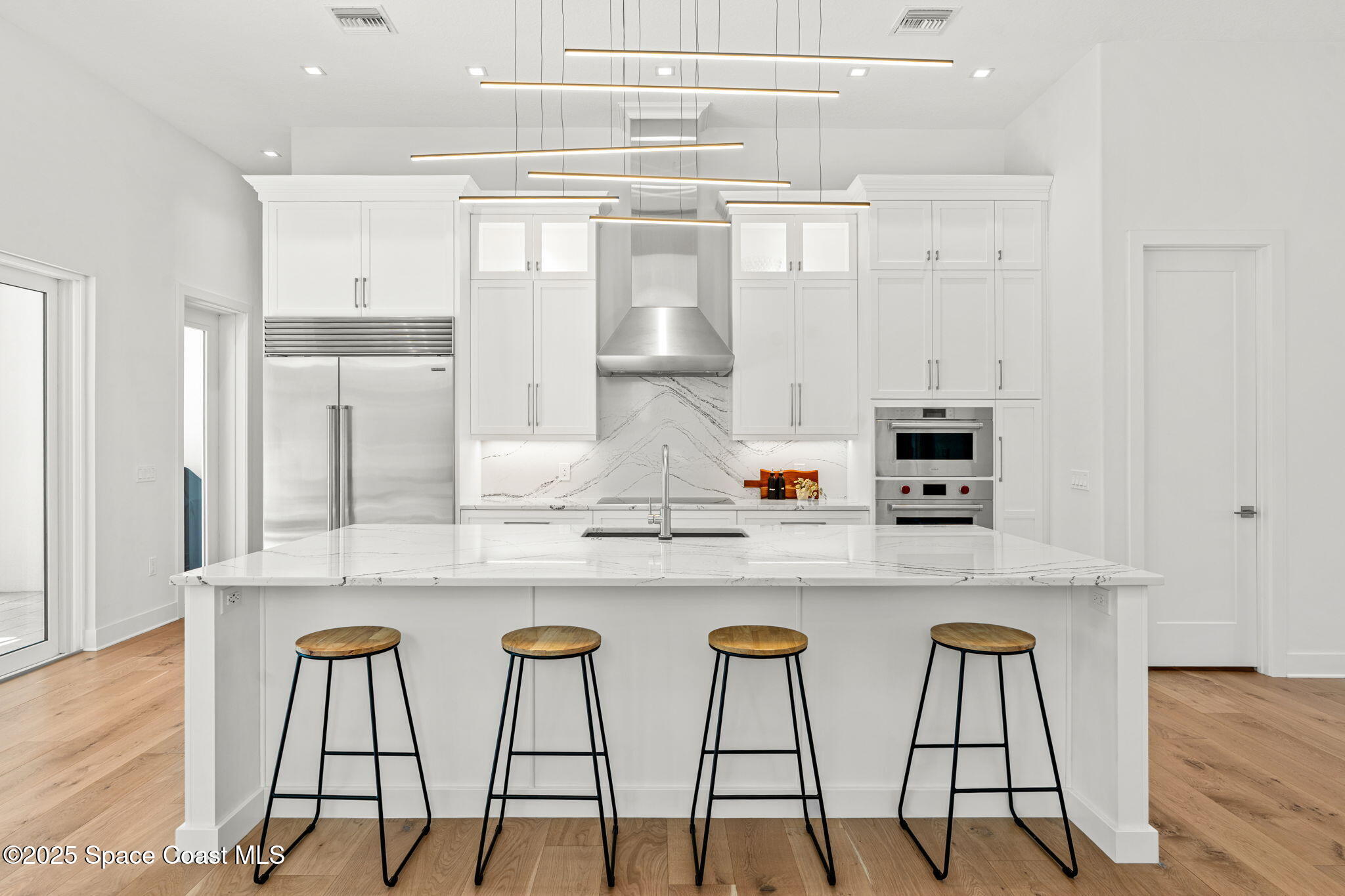 1949 Rockledge Drive Rockledge, FL 32955 - Photo 10 of 48 a kitchen with cabinets and chairs