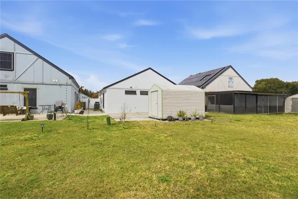 a front view of house with yard patio and green space