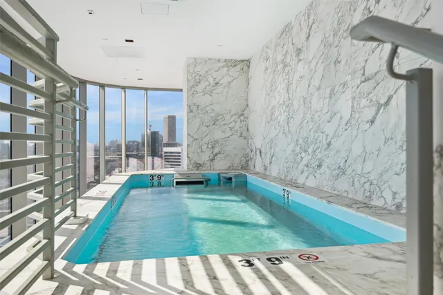 a view of a swimming pool with a garden