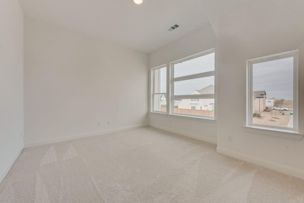 1717 Rodeo Drive Celina, TX 75009 - Photo 27 of 38 an empty room with windows