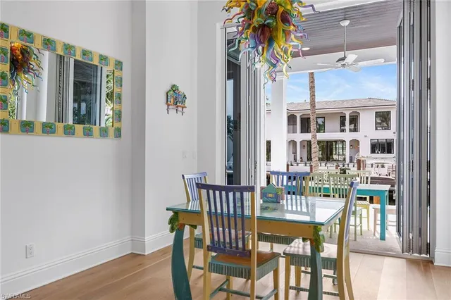 a view of a dining room with furniture and chandelier