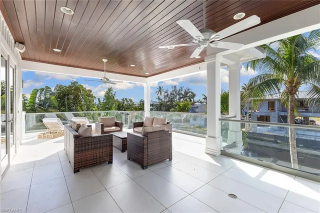 a view of a patio with couches and potted plants