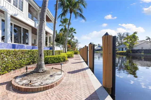 a view of a backyard with sitting area