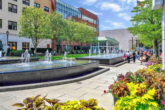 a picture of a bench in front of a wall